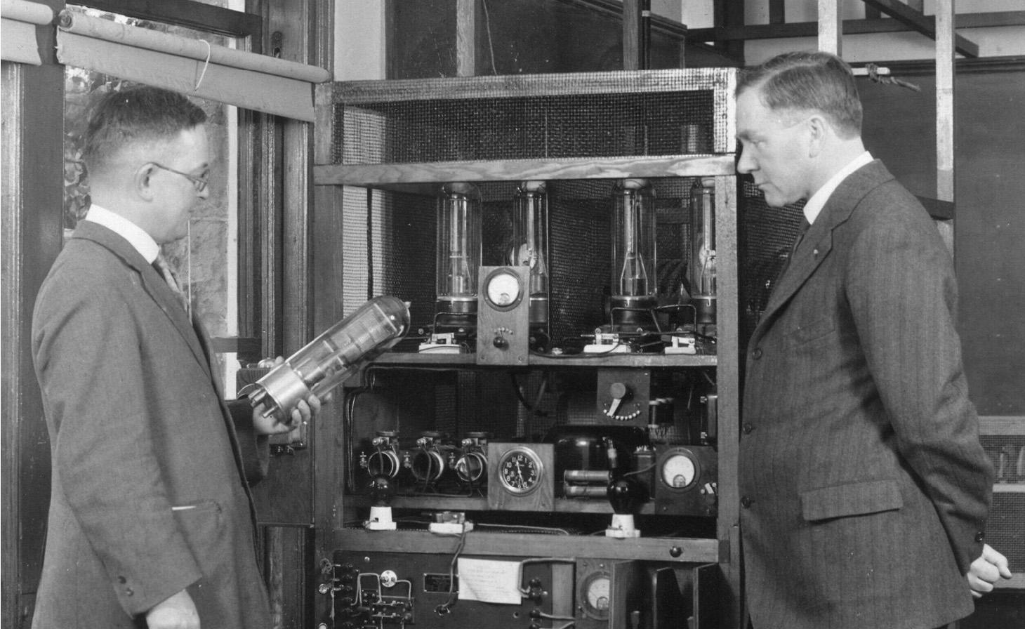 Professor Jordan (left) and Prof. Weniger (right) photographed in 1928 with an early radio transmitter, KFDJ, 5 watts.